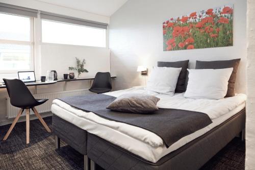 Postel nebo postele na pokoji v ubytování HORISONT Hotel & Konference