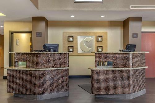 a lobby of a hotel with two checkout counters at Comfort Suites Buda - Austin South in Buda