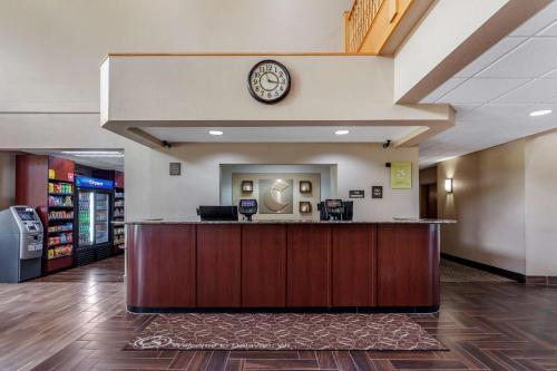 a hotel lobby with a clock on the wall at Comfort Suites Delavan - Lake Geneva Area in Delavan