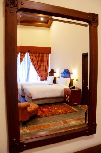 Ένα ή περισσότερα κρεβάτια σε δωμάτιο στο Pearl Continental Hotel Malam Jabba