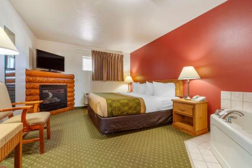 Ένα ή περισσότερα κρεβάτια σε δωμάτιο στο Harmony Inn & Suites