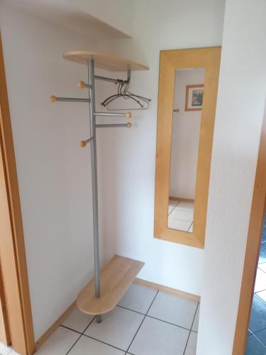 a bathroom with a sink and a mirror at Ferienwohnung in Riol