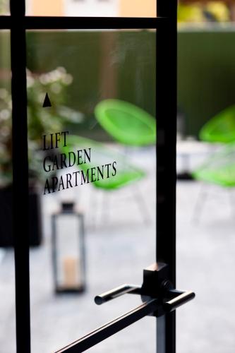 a window with a let garden appliances sign on it at Eric Vökel Boutique Apartments - Copenhagen Suites in Copenhagen