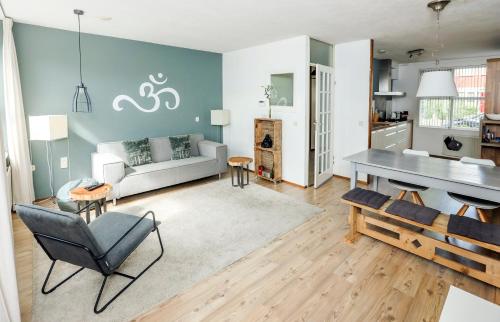 a living room with a couch and a table at Diemer 6 in Groningen