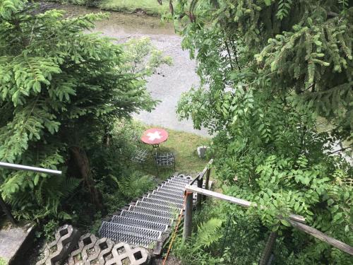 an overhead view of a bench in a forest at Appenzellerland - Ferienhaus "Bömmeli" in Hundwil