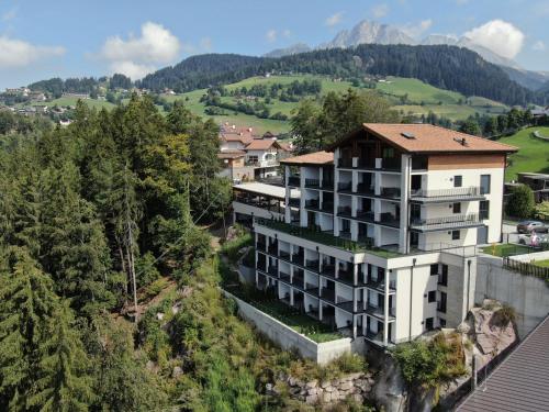 a building on the side of a mountain at Panoramaresidence Hafling in Avelengo