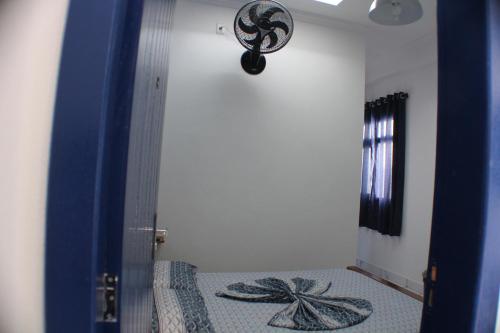 Ein Bett oder Betten in einem Zimmer der Unterkunft Pousada Flor de Aurora Bertioga