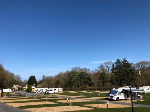 a group of rvs parked in a park at Shepherds Hut at Wern Mill in New Quay