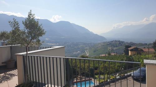 a balcony of a house with a view of mountains at Hotel Garni Herz in Tirolo