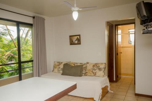 Un pat sau paturi într-o cameră la Recanto Praia Azul