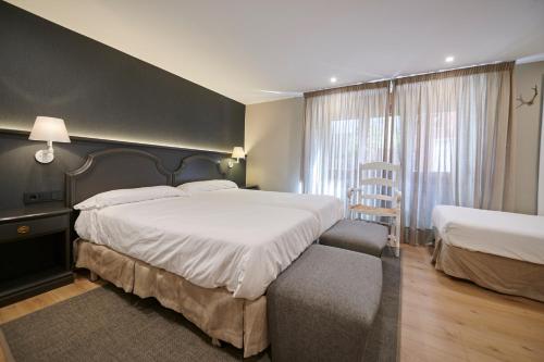 Ένα ή περισσότερα κρεβάτια σε δωμάτιο στο Hostal Lola
