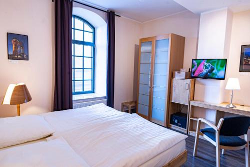 Postel nebo postele na pokoji v ubytování Hotel Birschel-Mühle