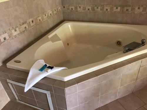 a white bath tub with a towel on it at Fairbridge Inn Express - Barrington in Barrington