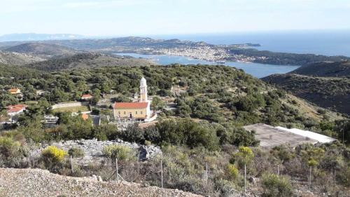 an island with a church on top of a hill at Ionian Balcony - Davgata in Dhavgáta