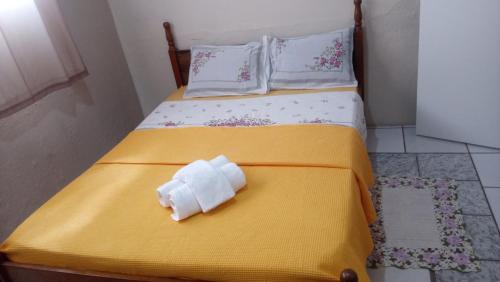 Säng eller sängar i ett rum på Pousada Nascentes da Canastra