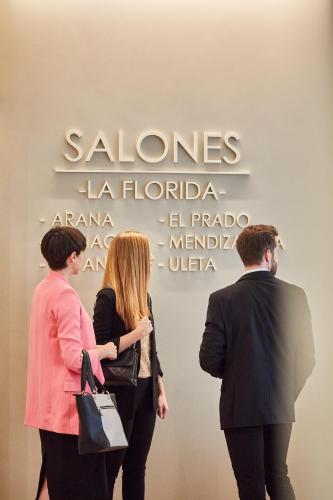 a group of people standing in front of a wall at Silken Ciudad de Vitoria in Vitoria-Gasteiz