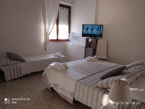 Postel nebo postele na pokoji v ubytování Bab San Feliciano Camere Foligno
