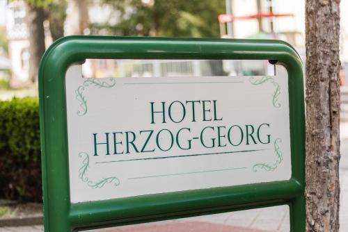 a sign for a hotel hermoso gacco at Hotel Herzog Georg in Bad Liebenstein
