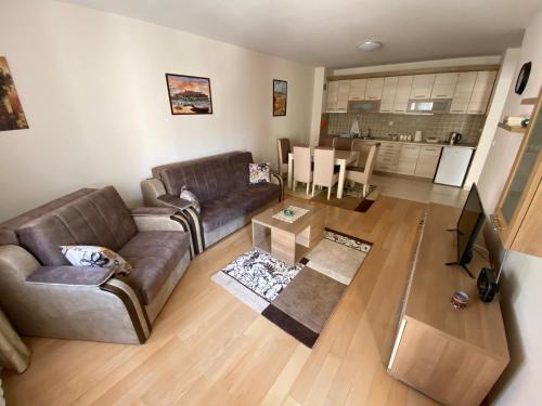 a living room with a couch and a table at Apartman Bozur in Vrnjačka Banja