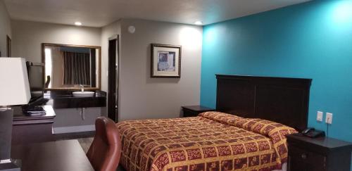 מיטה או מיטות בחדר ב-Delux Inn Mesquite