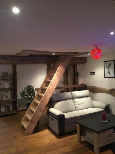 a living room with a couch and a loft bed at Amazing View appartement du Chalet in Les Houches
