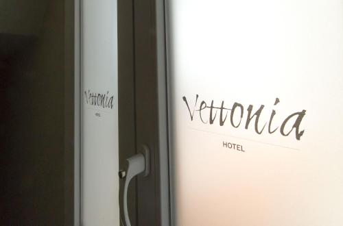 a refrigerator with a sign on the side of it at Vettonia Hotel in Merida