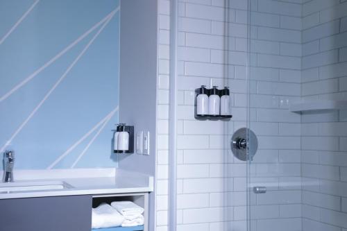 a bathroom with a shower and a sink at avid hotel - Fresnillo by IHG in Fresnillo de González Echeverría