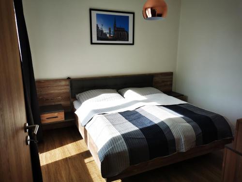 Llit o llits en una habitació de Apartmán Mlýnská Strouha