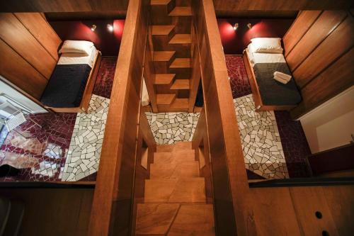 an overhead view of a room with two bunk beds at NAP Hostel Spaccanapoli in Naples
