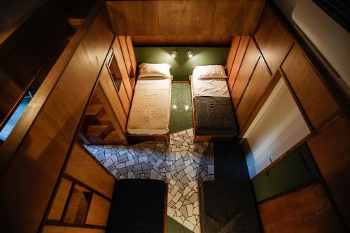 an overhead view of two beds in a room at NAP Hostel Spaccanapoli in Naples