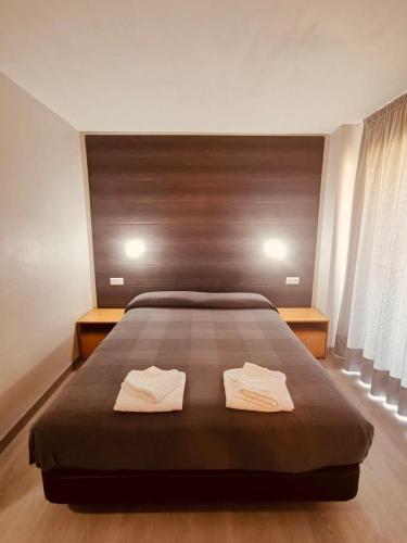 Letto o letti in una camera di Hotel Delicias