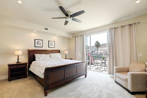 a bedroom with a bed and a couch and a window at 219 San Miguel in Avila Beach