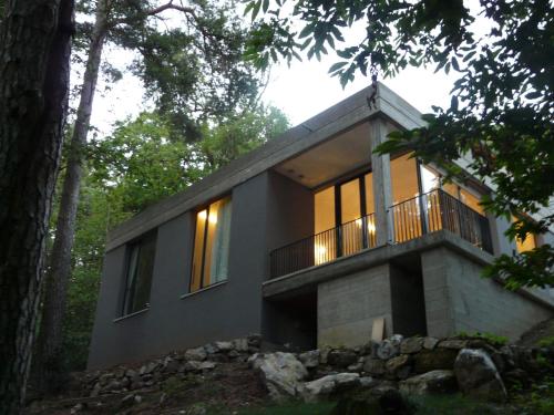 a house in the woods with a balcony at Varesello 20 in Brunate