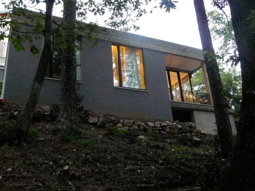 a house with trees in front of it at Varesello 20 in Brunate