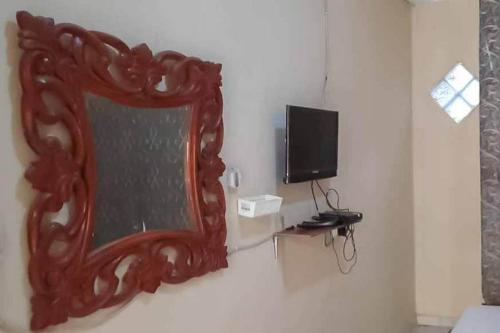 TV a/nebo společenská místnost v ubytování Pakansari Guest Inn Mitra RedDoorz