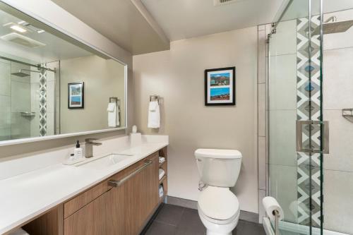 a bathroom with a toilet and a sink and a shower at Matterhorn Inn in Sedona