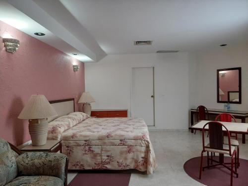 Hotel Tamazunchale tesisinde bir odada yatak veya yataklar