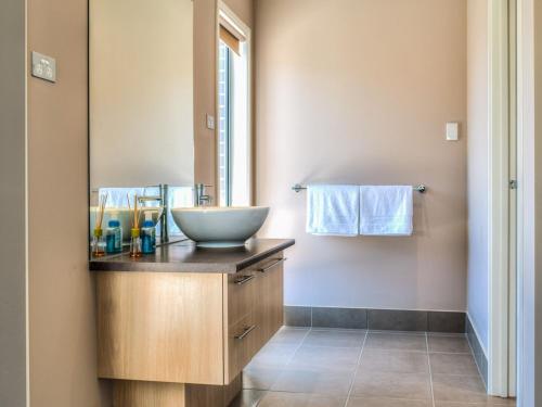 a bathroom with a bowl sink on a counter at Valencia in Cowes