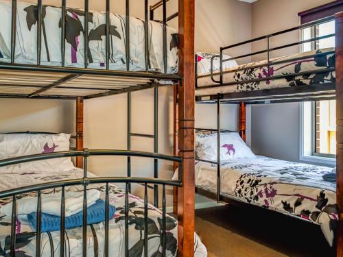 a bunk bed room with two bunk beds and a window at Valencia in Cowes