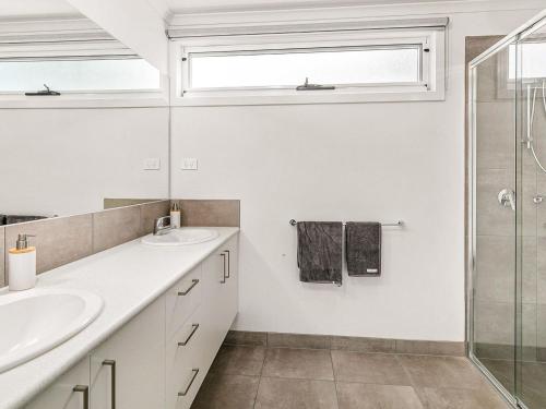 a bathroom with two sinks and a shower at San Freemo in San Remo