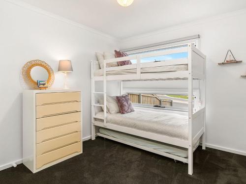 a bedroom with a white bunk bed and a dresser at San Freemo in San Remo