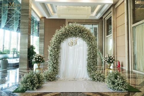 a wedding arch in the lobby of a building at The Mira Central Park Hotel in Bien Hoa