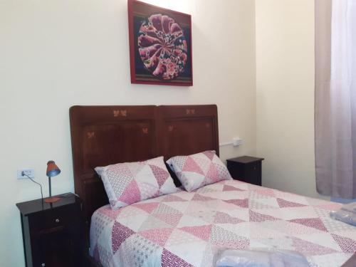 Ένα ή περισσότερα κρεβάτια σε δωμάτιο στο B&B La Locanda