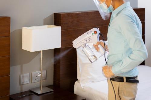  Action Hotel Ras Al Khaimah -  Room  picture :   Tea/Coffee maker    Minibar    Shower                           