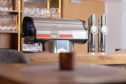 a coffee machine sitting on top of a counter at Gasthof Aigner *** in Fügen