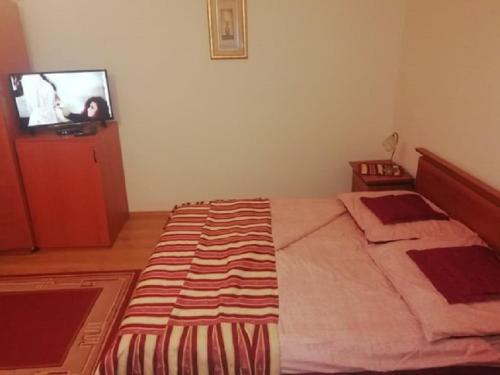 Кровать или кровати в номере ASTA LA VISTA Vendégház