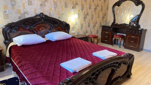 Кровать или кровати в номере Отель "Золотой Лотос"