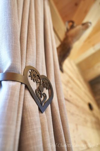 a heart shaped curtain with a heart lock on it at Chalet Leßner in Leutasch