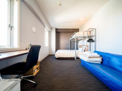 Кровать или кровати в номере Super Hotel Saitama Omiya West