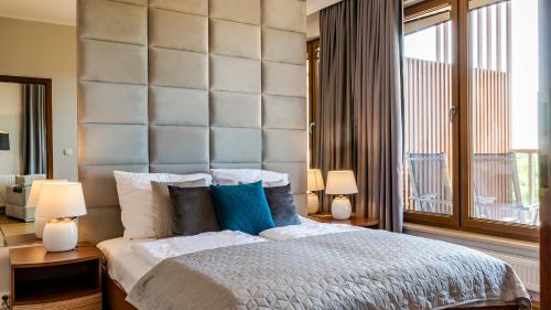 מיטה או מיטות בחדר ב-VacationClub - Olympic Park Apartment A604